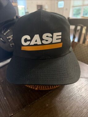 Source Unknown Black Hat with White CASE Logo and Gold Stripe